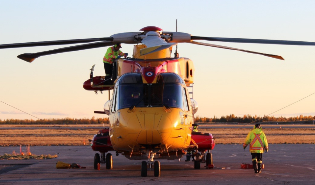Civil Air Search and Rescue Association (CASARA) staff preparing helicopter for flight